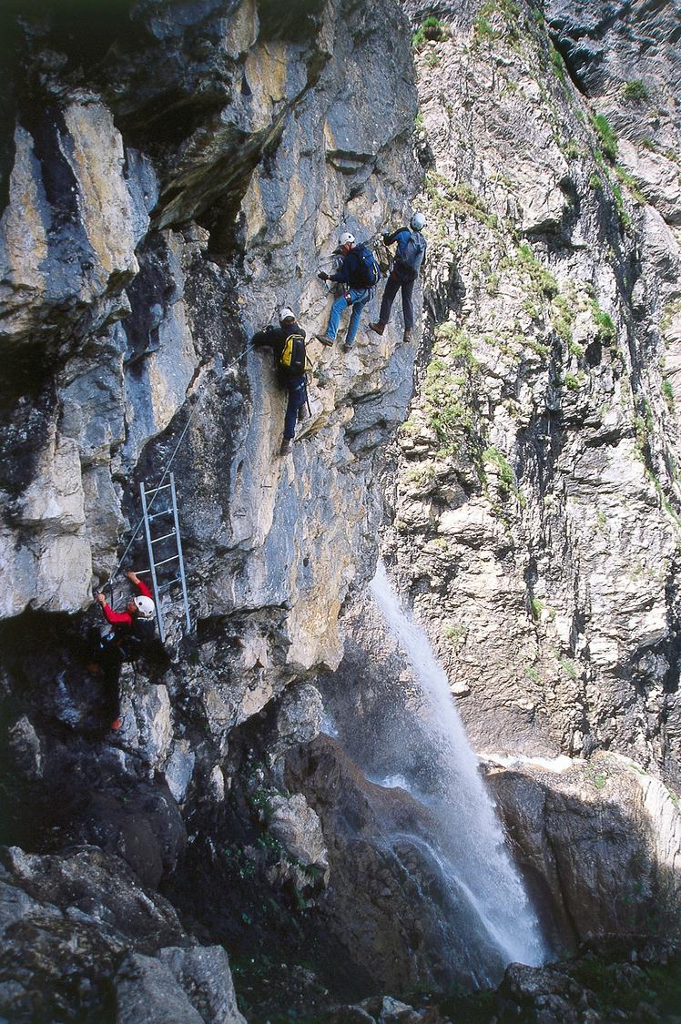 Climbing around the corner on iron rungs