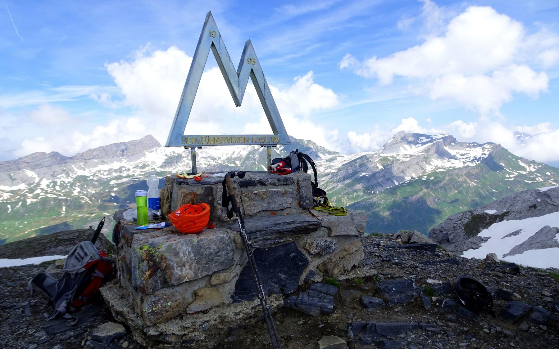 The summit marker / bench.